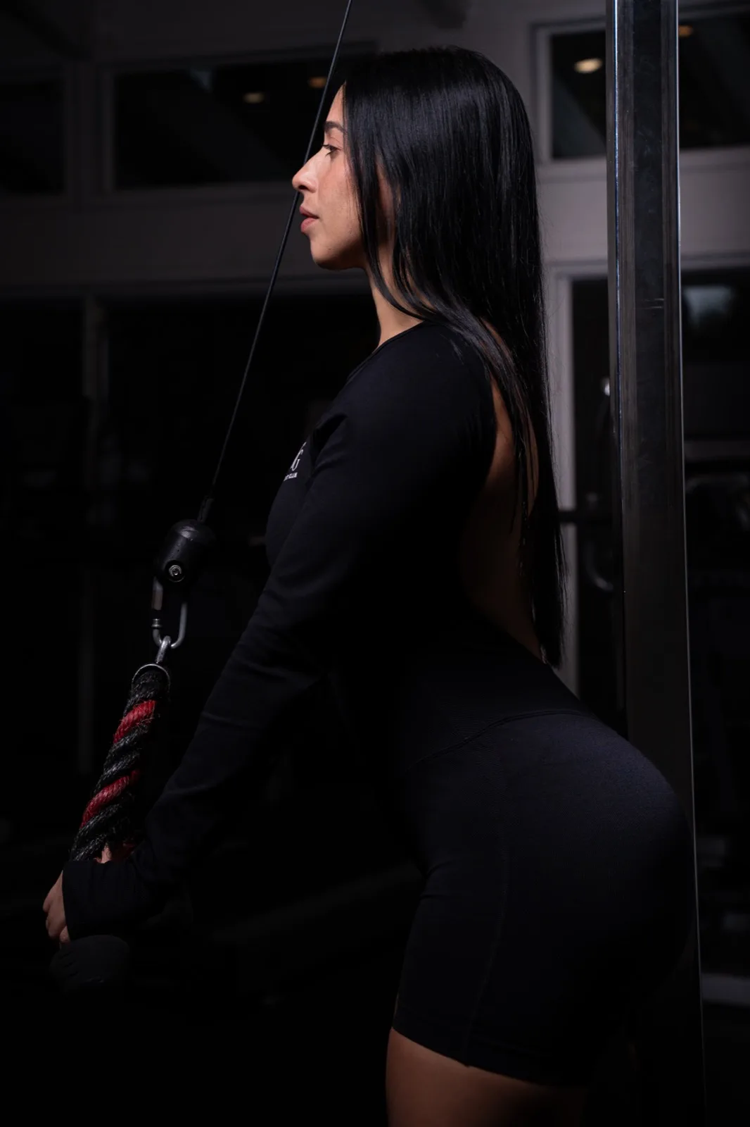 The open-back one-piece in black, profile